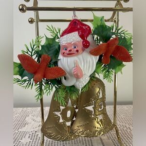 Vintage plastic Santa Claus with bells and wreath Christmas ornament